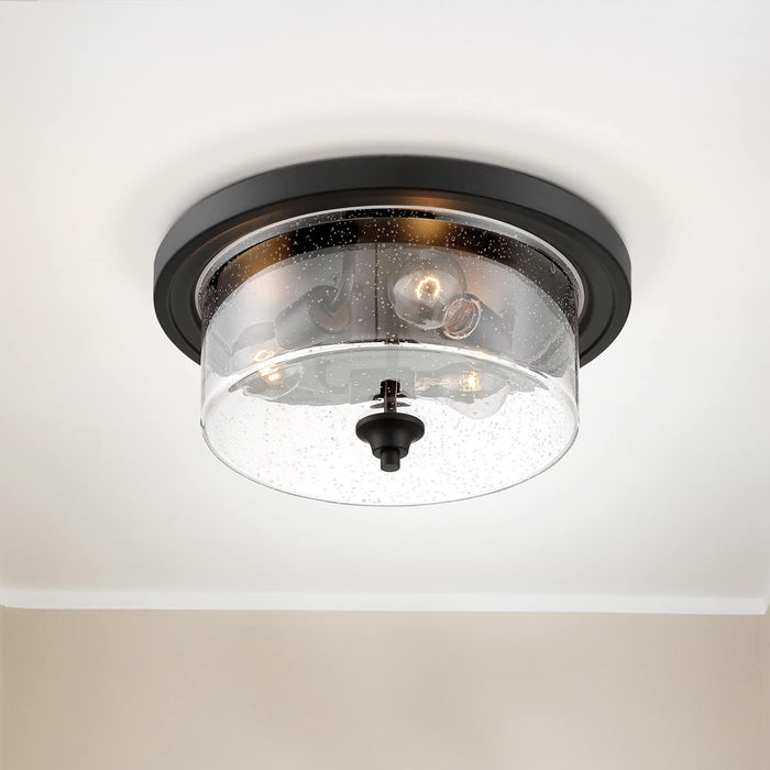 Flush Mount Nuvo 60-7291 Bransel - 3 Light - Flush Mount Fixture - Matte Black Finish with Clear Seeded Glass Nuvo