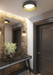 Modern interior design of a hallway with a mirror, console table, and door.