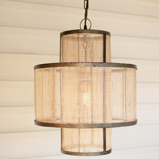 Pendant light with woven design on a neutral background
