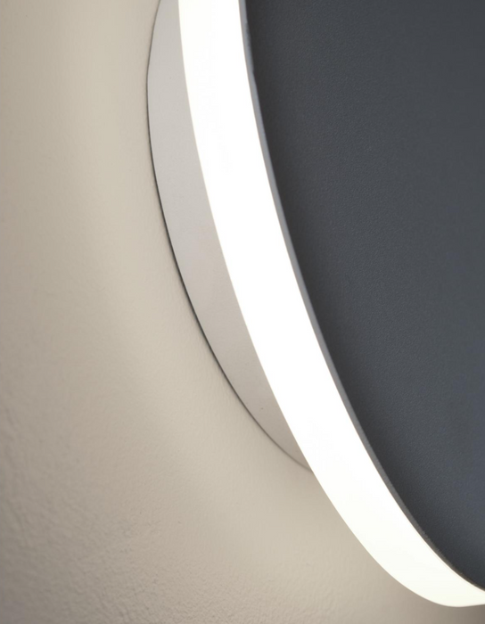 Close-up of a modern ceiling light fixture with a neutral background