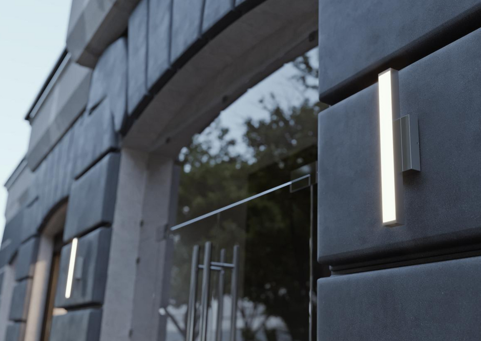 Modern building facade with glass doors and decorative metal elements